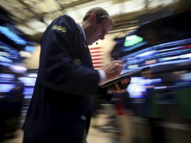 A trader works on the floor of the New York Stock Exchange in the Manhattan borough of New York